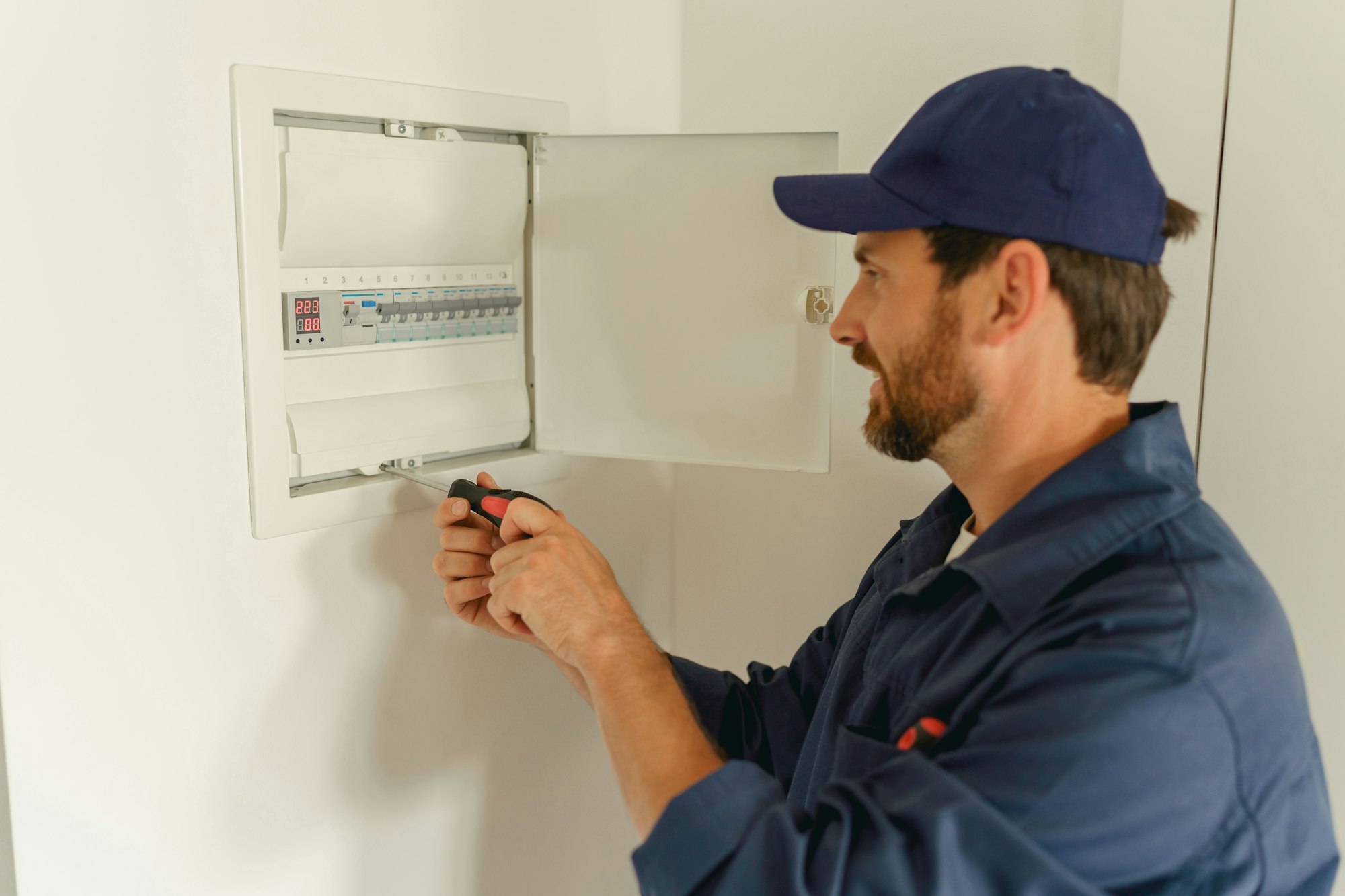 Professional male electrician inspect and repairing electrical systems in houses and buildings